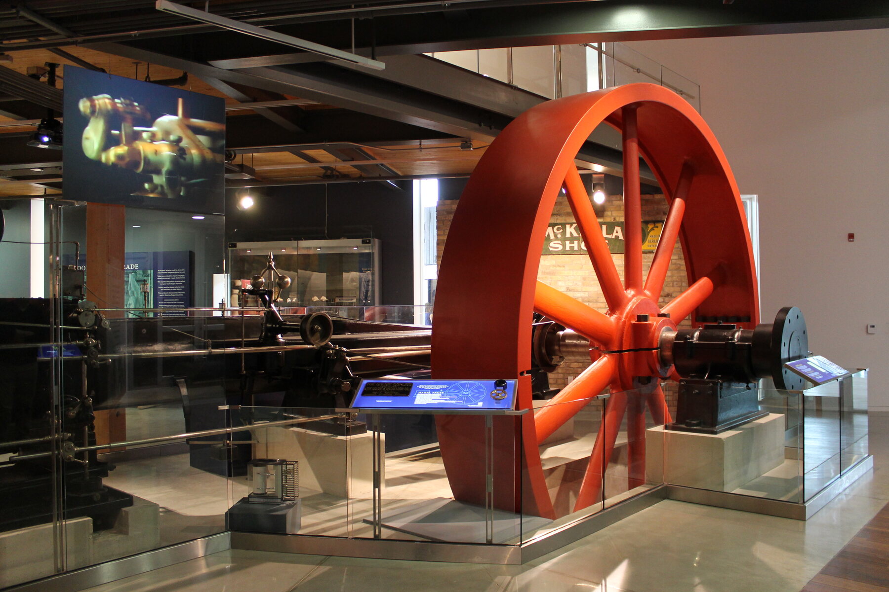 A preserved Goldie & McCulloch steam engine with a large red flywheel